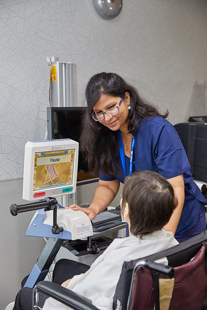 Highly skilled rehab therapist dealing with a patient who is feeling exhausted months after surgery at Fairview Rehab Center.