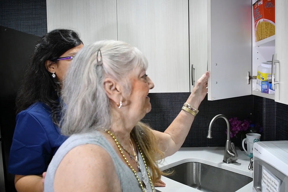 happy elderly woman in a rehabilitation center in brooklyn nyc after a stroke