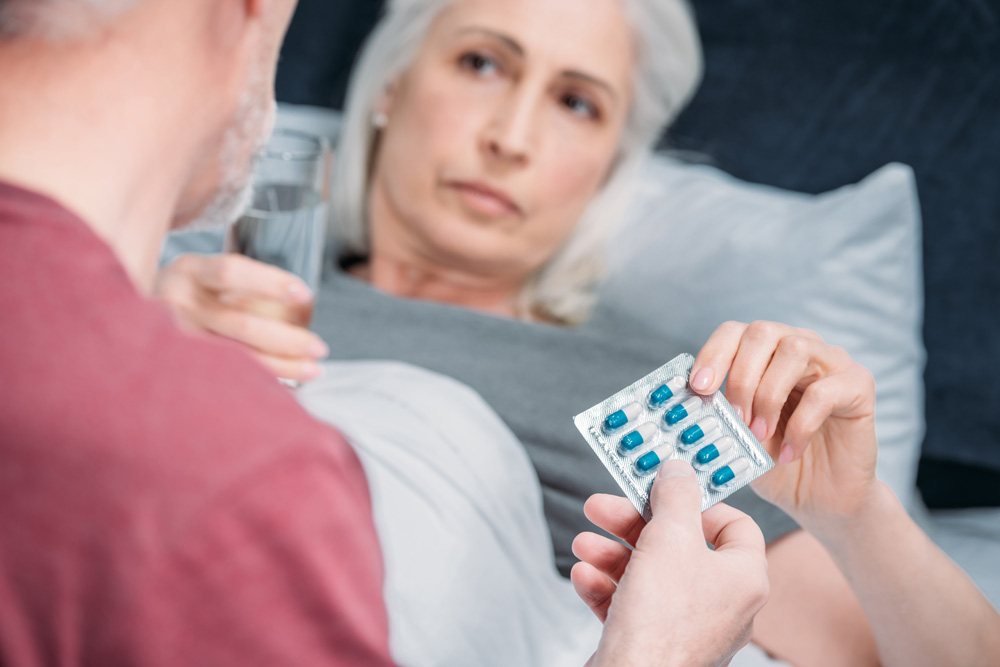 Infectious Disease Care Elderly women taking medicine for infectious disease care