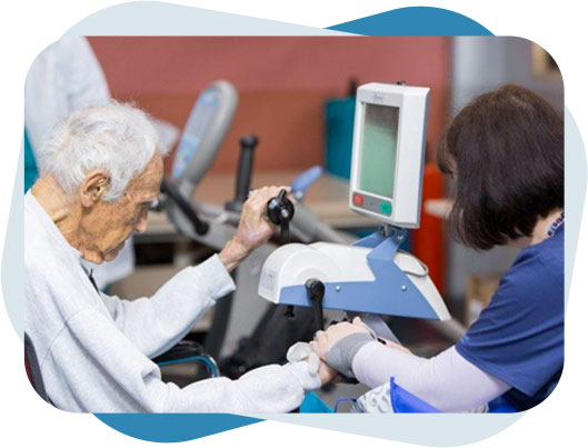 Nurse helping senior man with physical therapy.