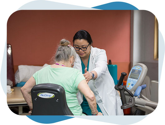 Female nurse providing post surgery care to an elderly woman.