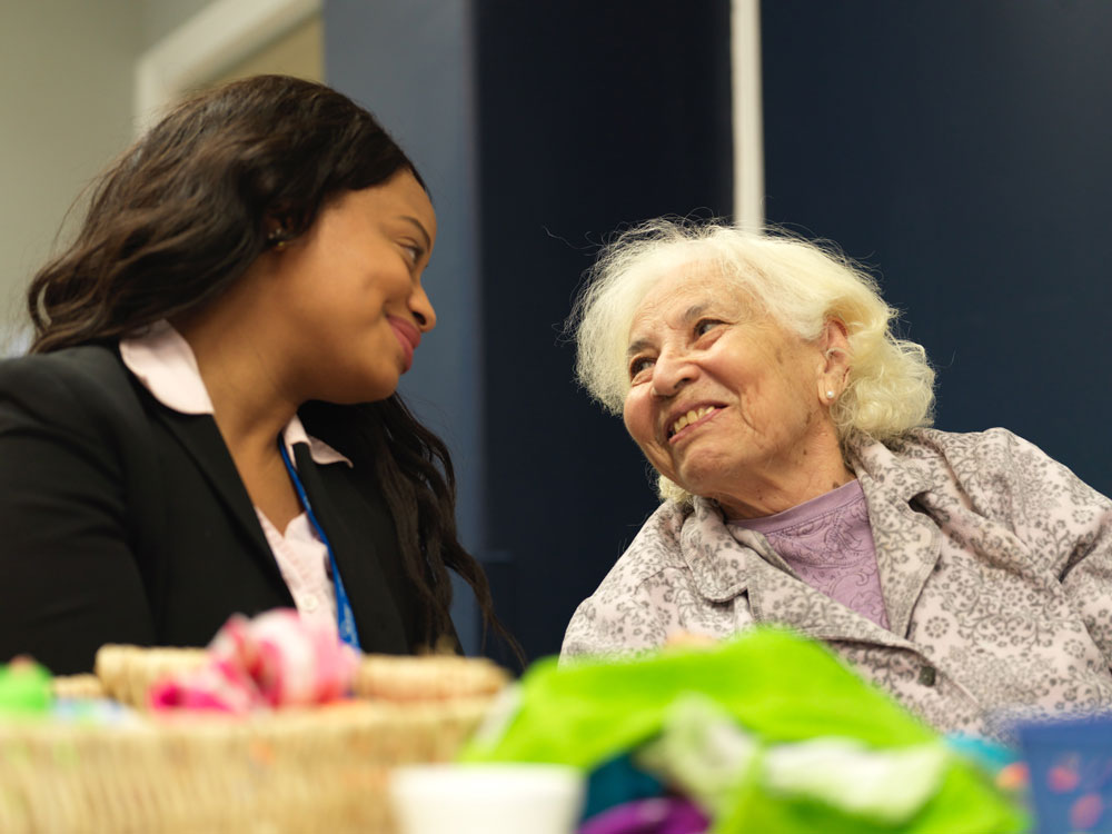 Happily satisfied elderly patient with nurse at Fairview Rehab & Nursing Home