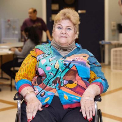 Geraldine Saver, Fairview Patient sitting on wheel chair.