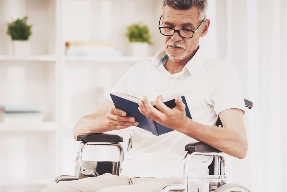 Senior man ready book to cope with anxiety