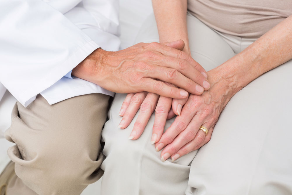 Doctor giving hope to a elderly women who is sufferings from brain damage