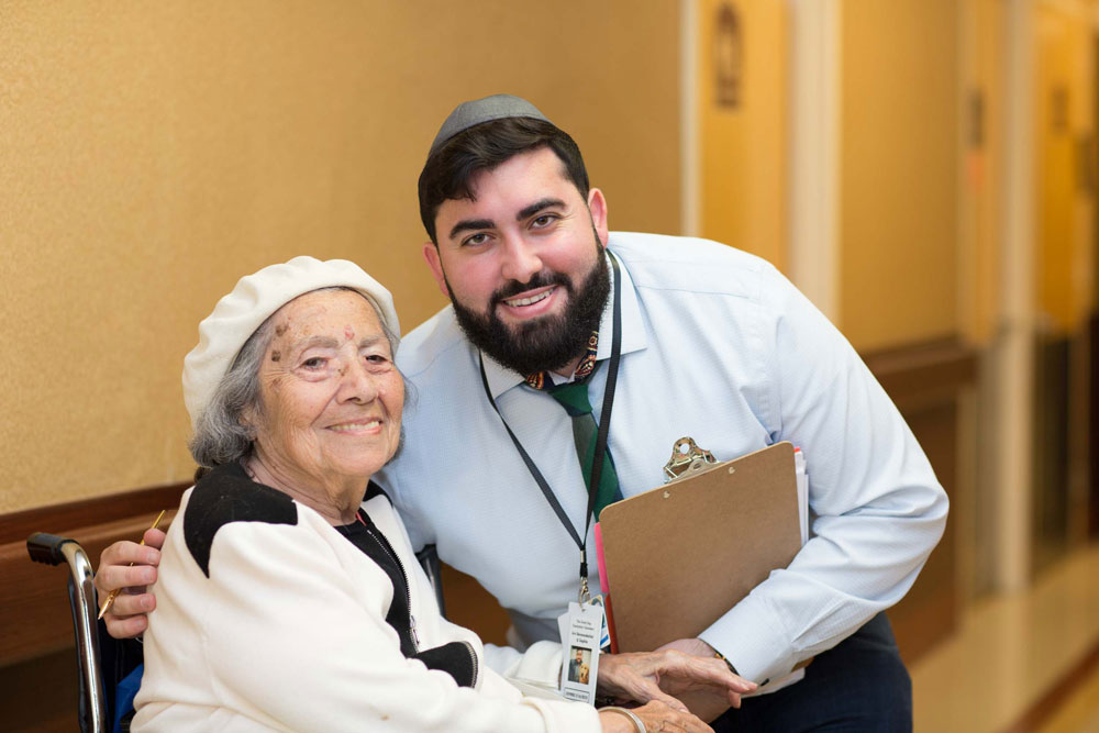 Rehabilitation staff providing compassionate care to an elderly woman