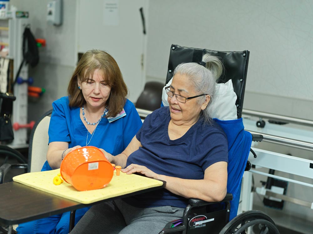 Brain Disorders Elderly women with brain disorders doing recreational activities