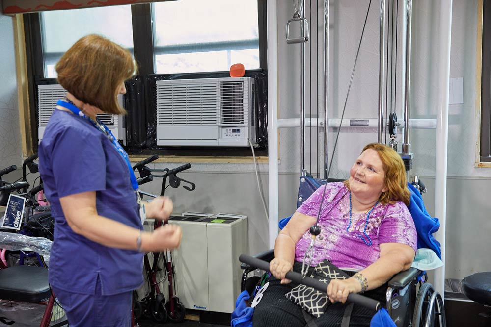 Elderly woman doing exercise for hip replacement recovery