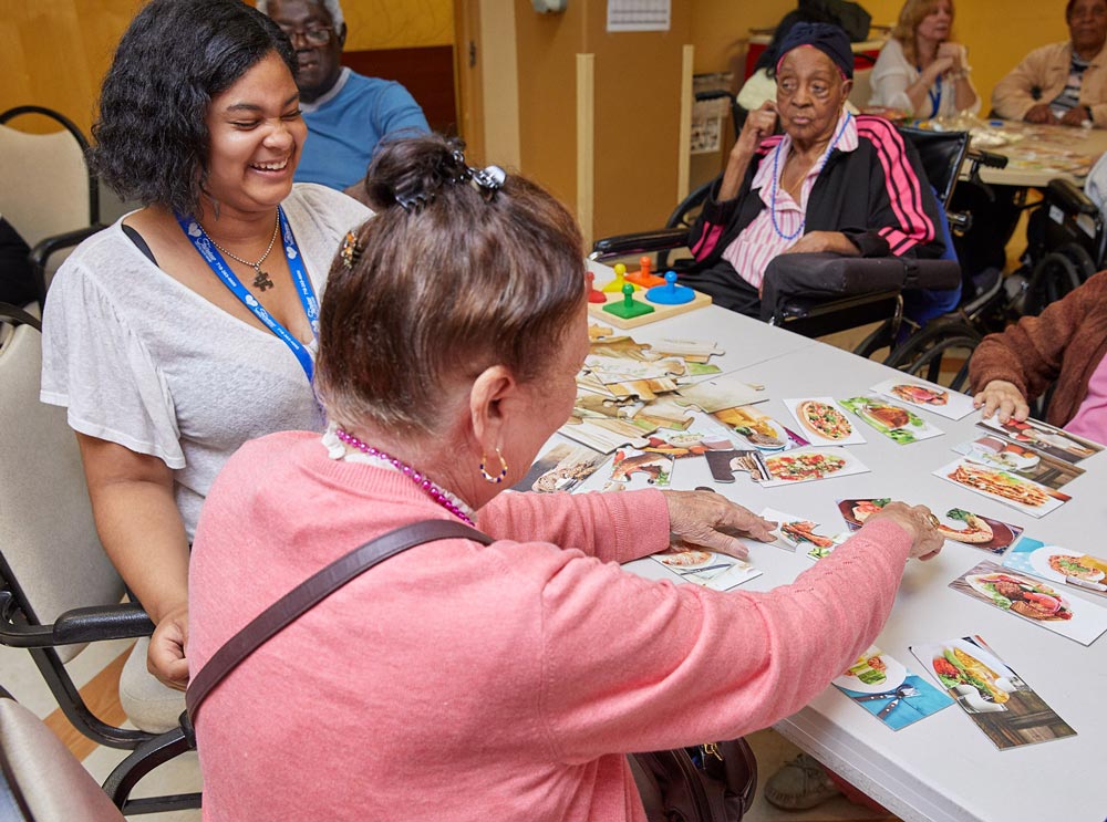 Senior women playing games for exercises for brain function. Pulmonary rehab for lung function.