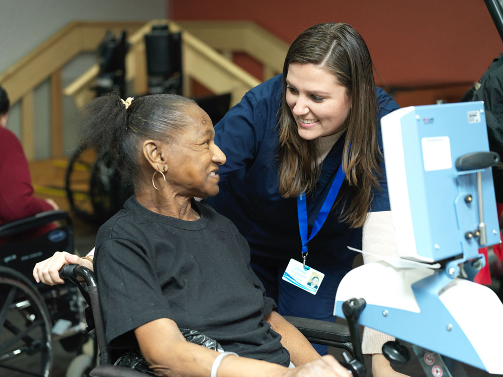 Nurse helping female patient with joint replacement. Care for patient with joint replacement. Physical therapy is the best treatment for Osteoarthritis.