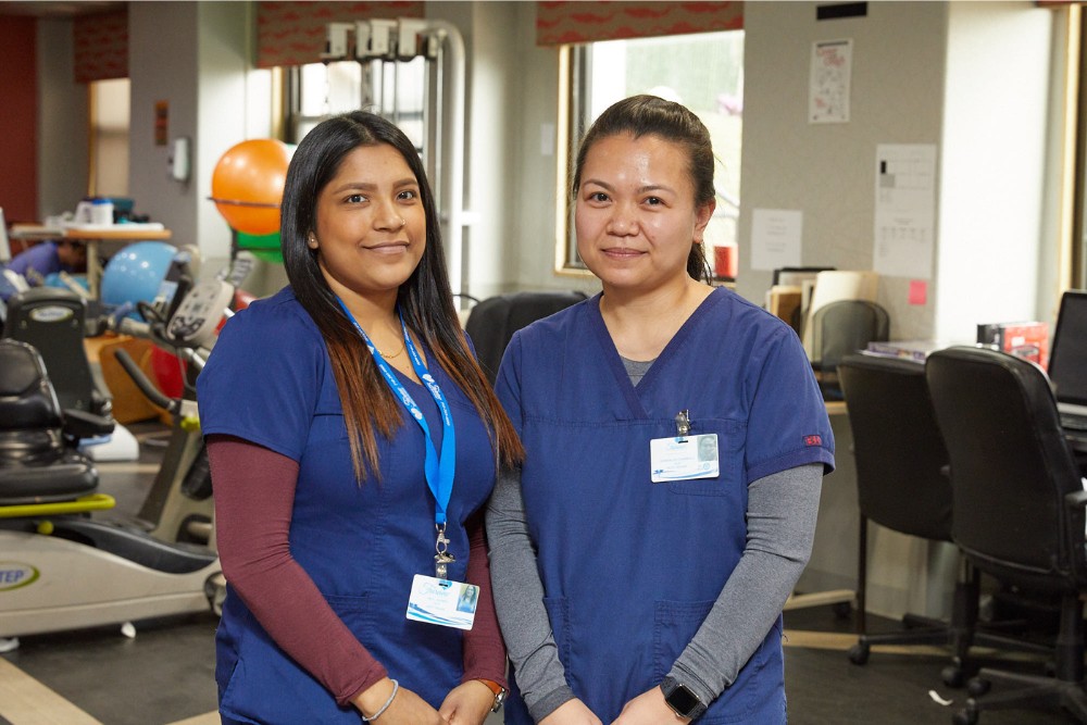 Neurological Disorders Affecting Speech Healthcare professionals in a clinical setting providing support for patients with neurological disorders affecting speech.